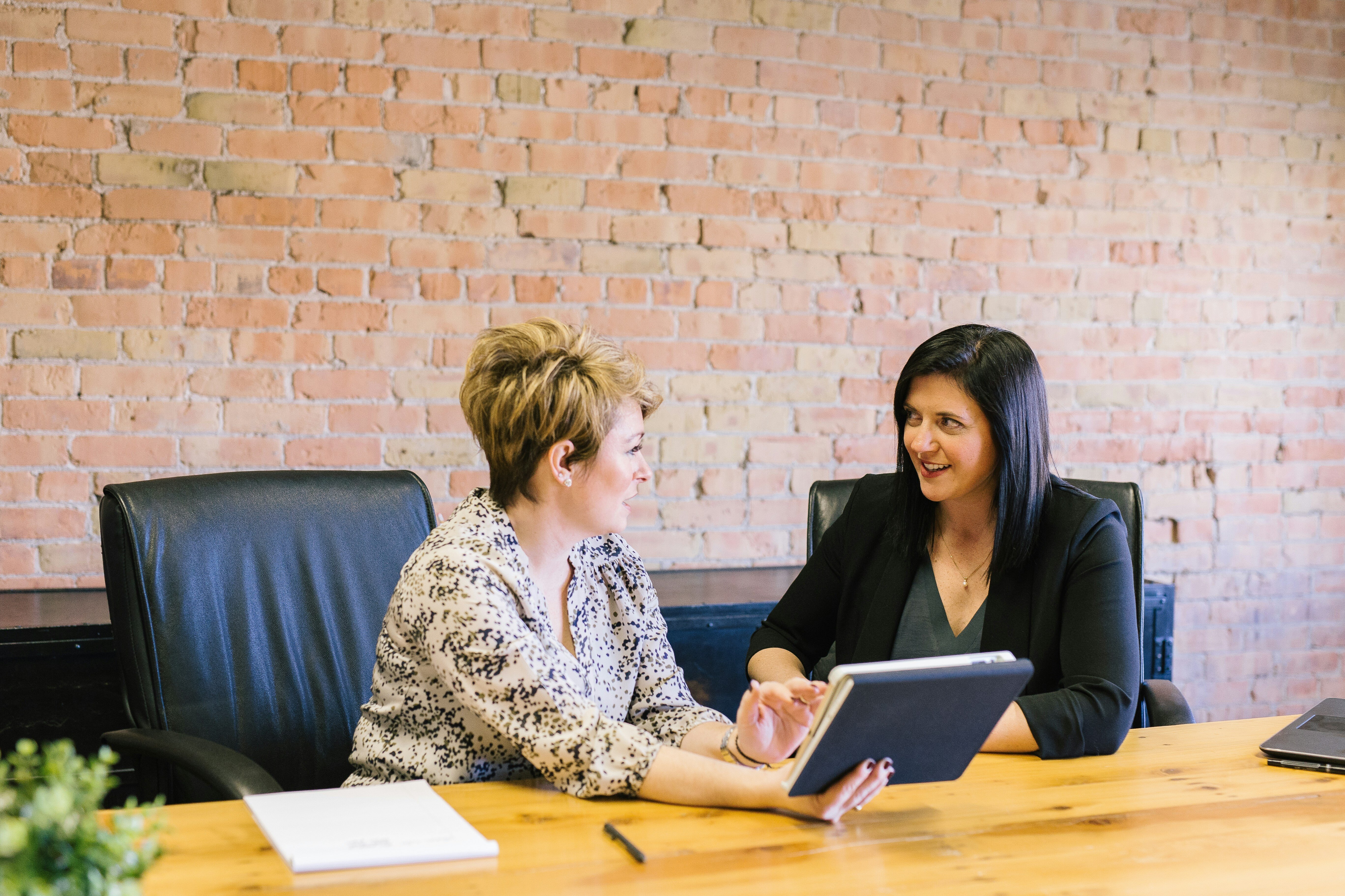 Businesswomen talking about outsourcing their IT