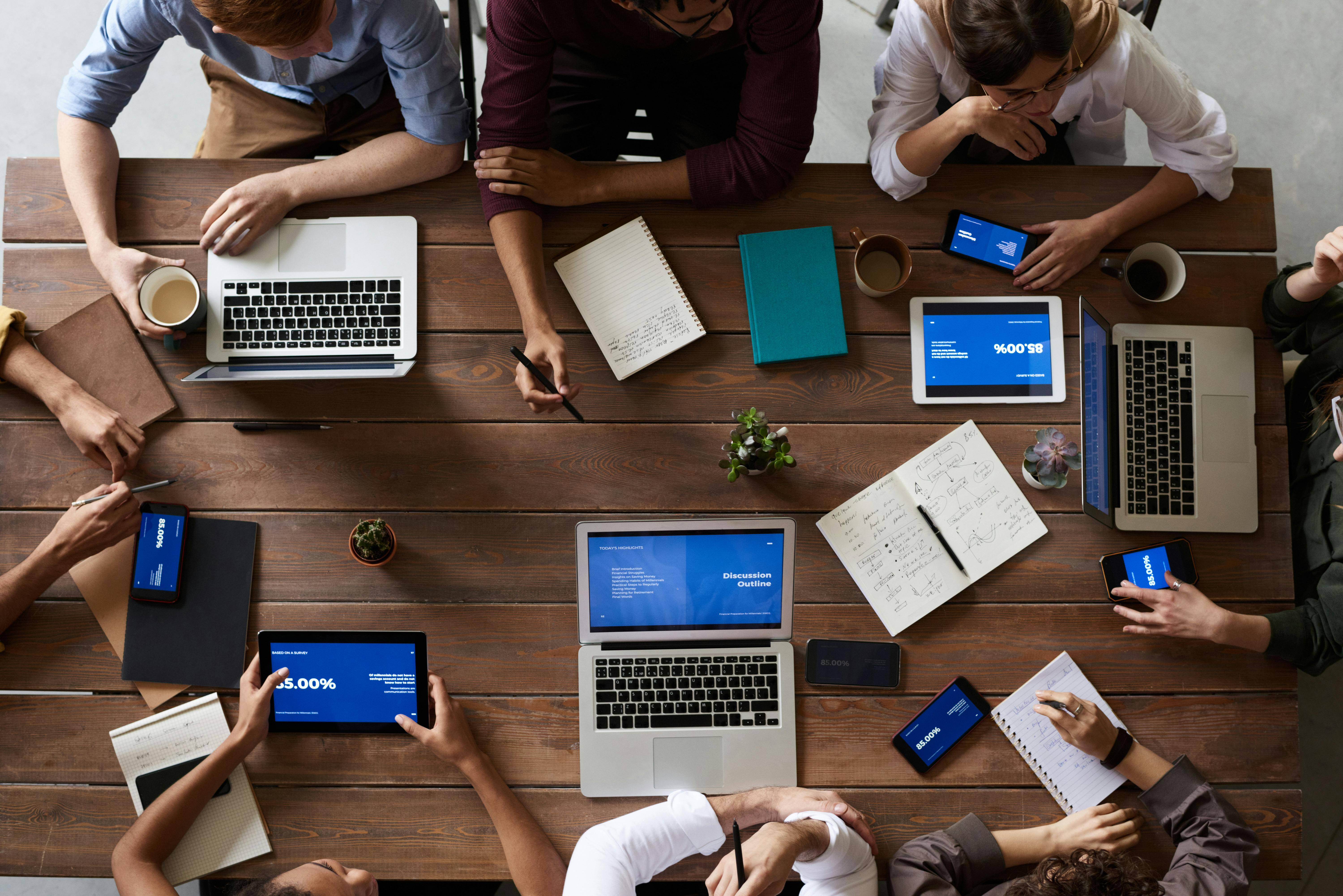 Group of people working in an office leveraging AI