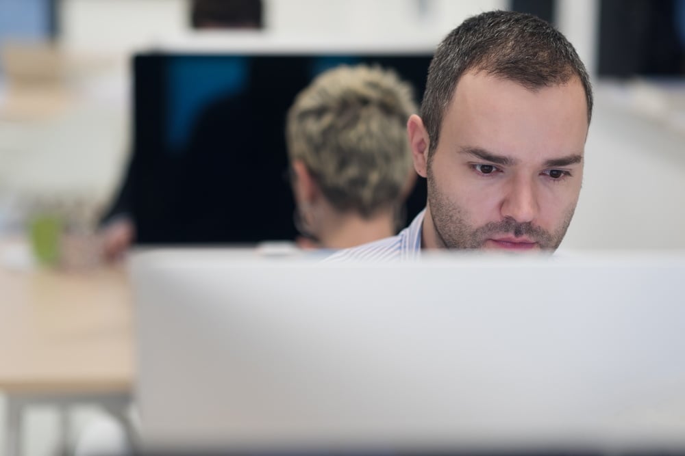 Looking at Laptop at an Employee Training on Cyber Security